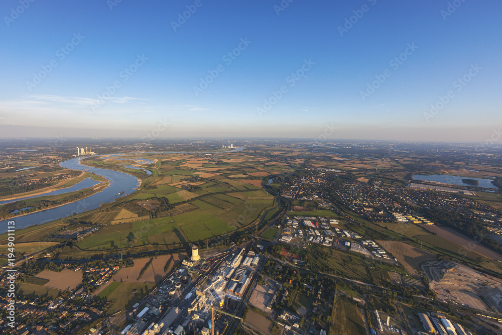 Rhine River with Industrial Park Solvay Rheinberg in the Lower Rhine Region of Germany