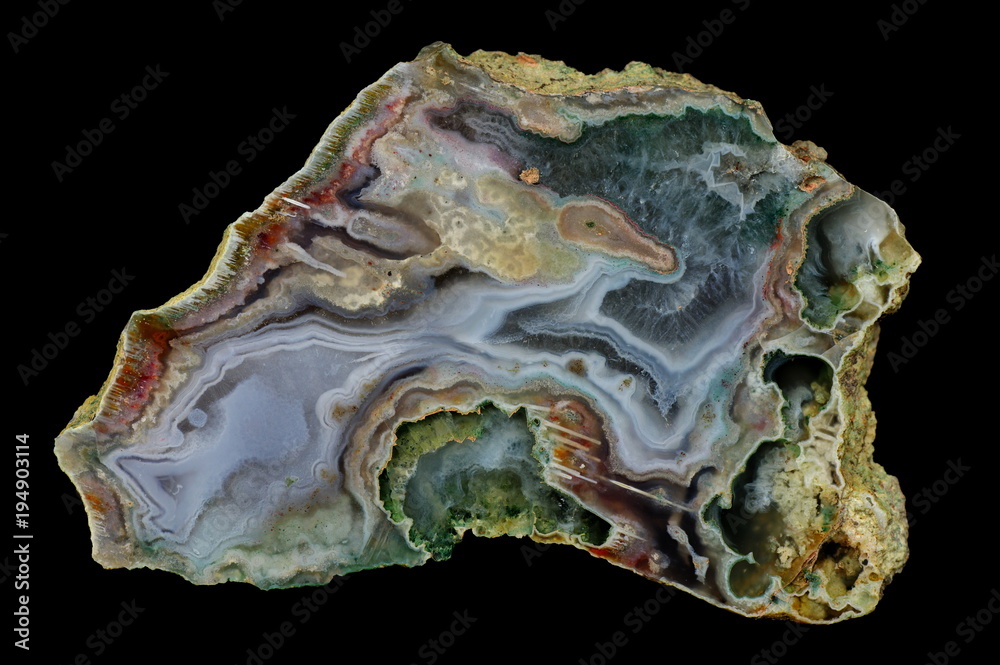A cross-section of agate. Multicolored silica bands colored with metal oxides are visible. Origin: Rudno near Krakow, Poland. A cross-section of agate. Multicolored silica bands colored with metal oxides are visible. Origin: Rudno near Krakow, Poland.