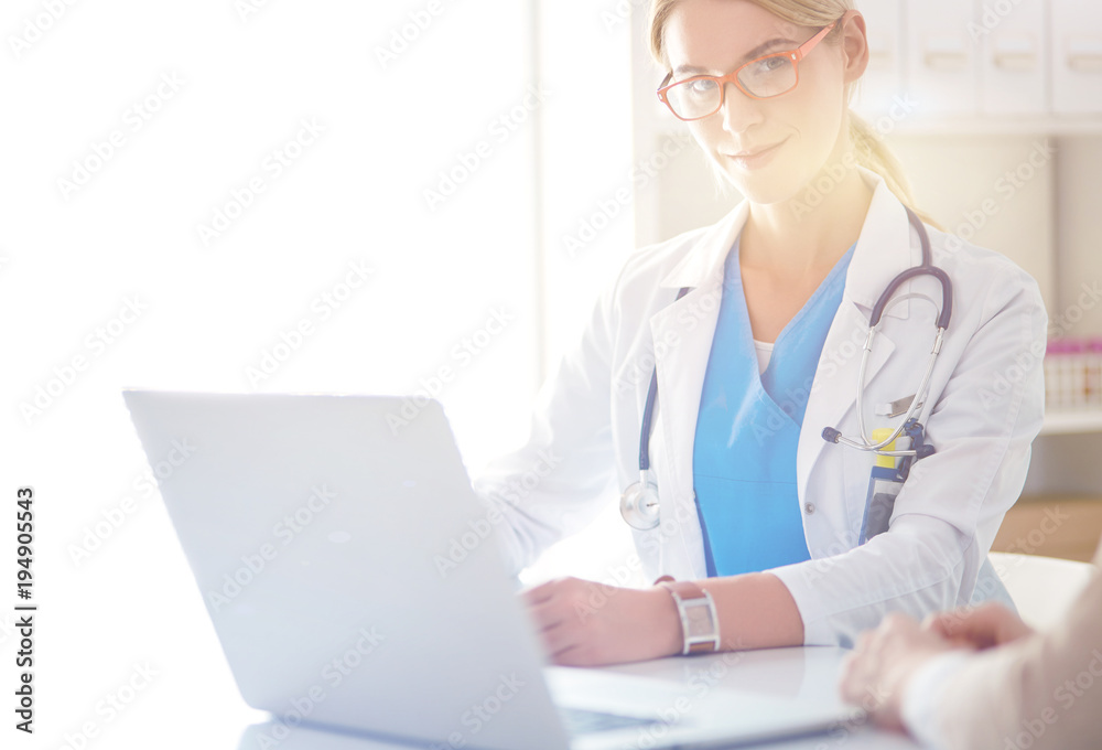 Doctor and patient couple are discussing something,sitting on the desk. Doctor and patient couple are discussing something,sitting on the desk.