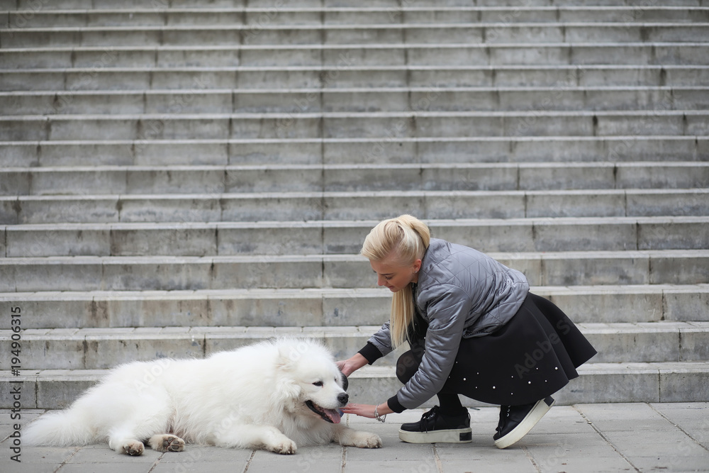 Lovely girl on a walk with a beautiful dog Lovely girl on a walk with a beautiful dog