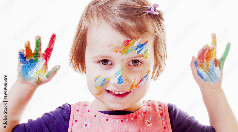 Colorful painted hands in a beautiful young girl Colorful painted hands in a beautiful young girl