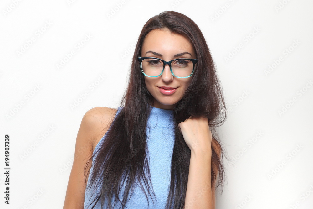 young girl in stylish glasses on a light background young girl in stylish glasses on a light background