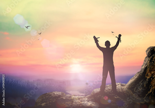 International human rights day concept: Silhouette human hand broken chains against mountain autumn sunset background