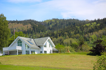 Fototapete Skandinavien Wooden house in Norway  © destillat