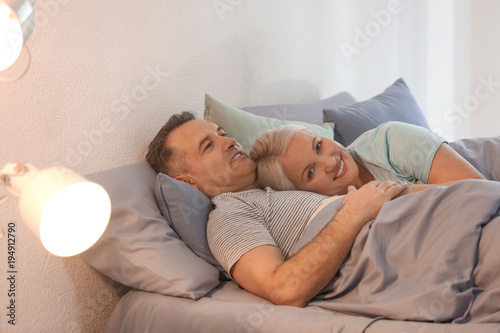 Senior couple in bed together