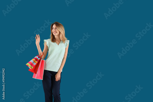 Happy young woman with shop...