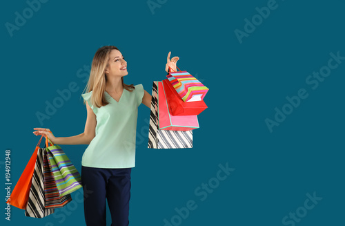 Happy young woman with shop...