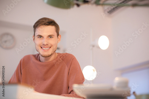 Young man working indoors