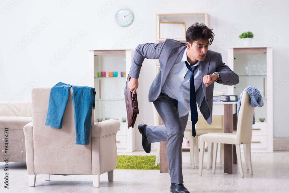 Businessman late for office due to oversleeping after overnight working Businessman late for office due to oversleeping after overnight working