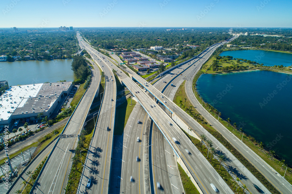 Aerial image highway interchange daytime motion blur cars - obrazy, fototapety, plakaty 