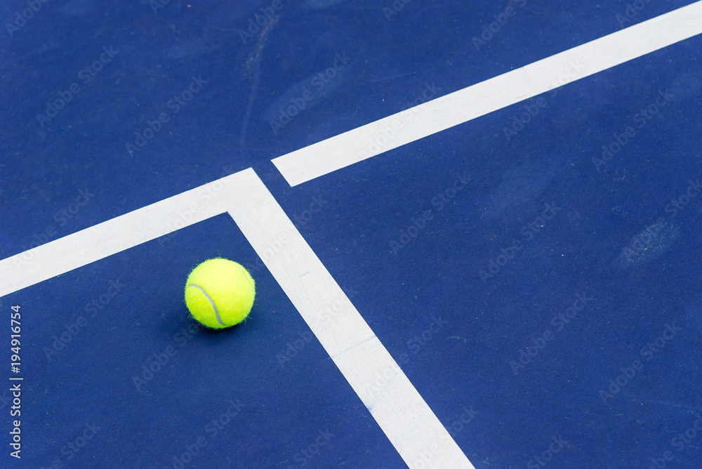 Tennis ball on the corner of court