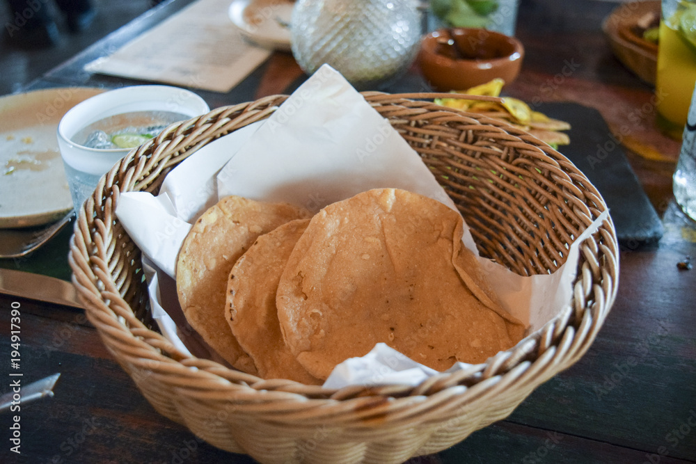 Fresh fried corn tortillas in basket