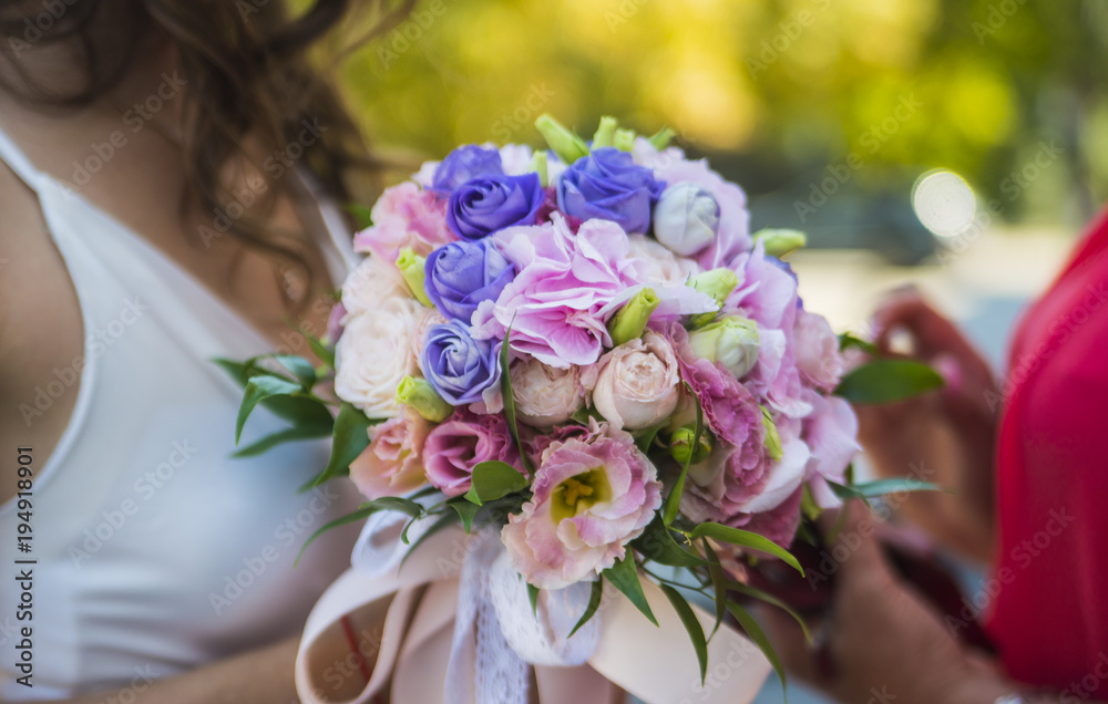 bridegroom taking wedding flowers in hand