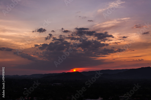 sunset over mountains or hills