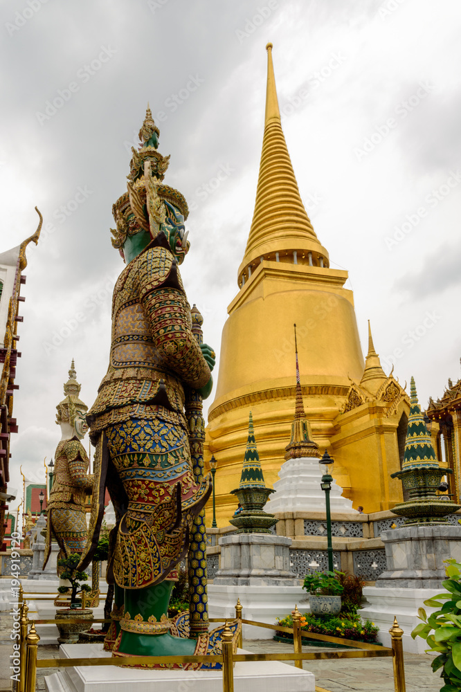 Naklejka premium Guard at Temple of the Emerald Buddha in Bangkok, Rainy Season