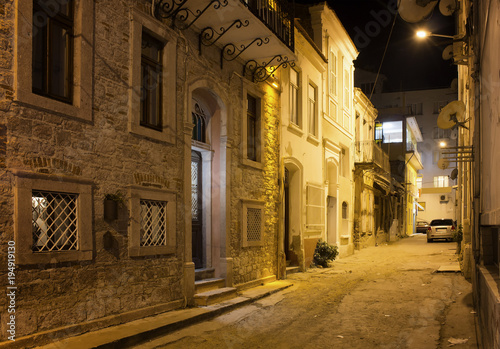 Night view of historical  old street in old town of Ayvalik. Sto