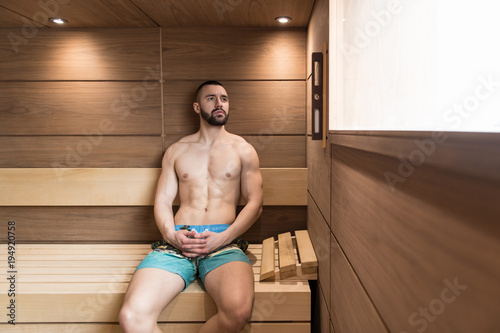 Portrait Of A Muscular Man Relaxing In Sauna
