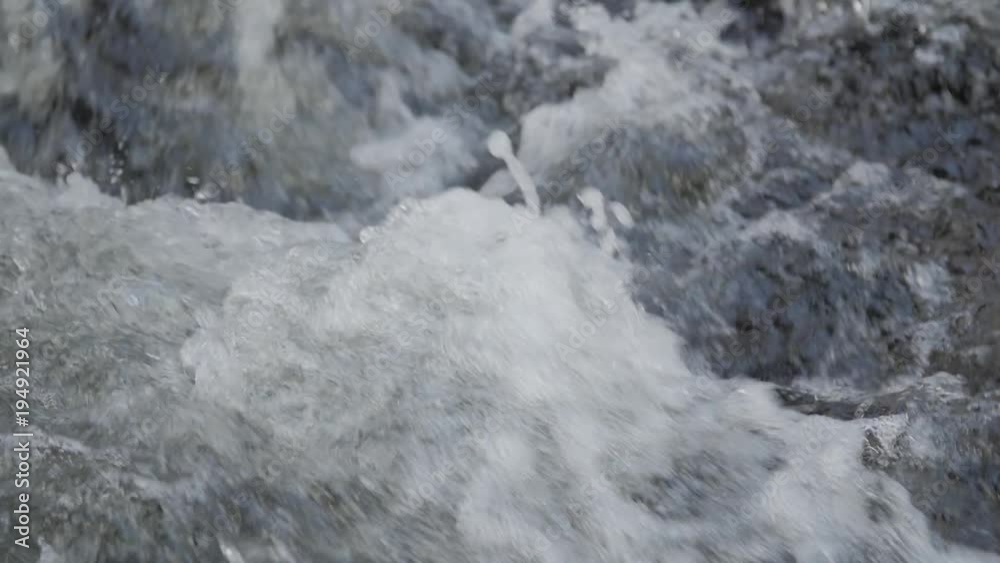 Close up of water stream with white and transparent bubbles. Slow motion. Close up of water stream with white and transparent bubbles. Slow motion.