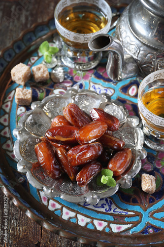 Canvas Print Oriental composition: ripe dates and green tea
