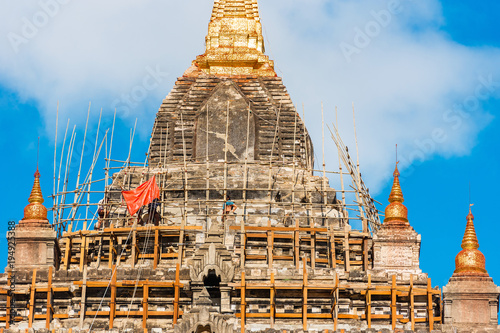 View of the facade of the building of Thatbyinnyu temple in Bagan, Myanmar. Close-up. photo