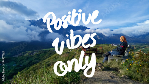 Positive Vibes Only quote against landscape view on sunny day. selected focus.