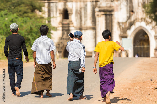 Group of a man walking on the road in Bagan, Myanmar. Copy space for text.