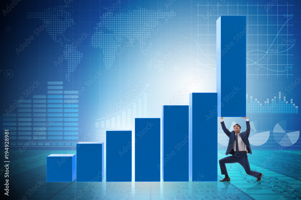 Businessman supporting growtn in economy on chart graph Businessman supporting growtn in economy on chart graph