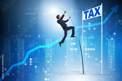 Businessman jumping over tax in tax evasion avoidance concept © Elnur