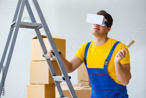 Painter contractor working with virtual reality goggles