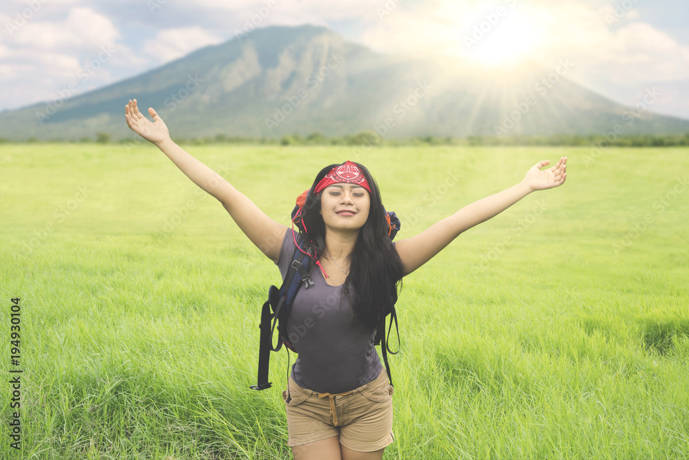 Young woman breathing fresh air in the mountain Young woman breathing fresh air in the mountain