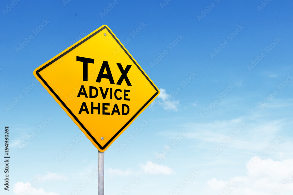 Tax advice road sign shot over beautiful blue sky. Tax advice road sign shot over beautiful blue sky.