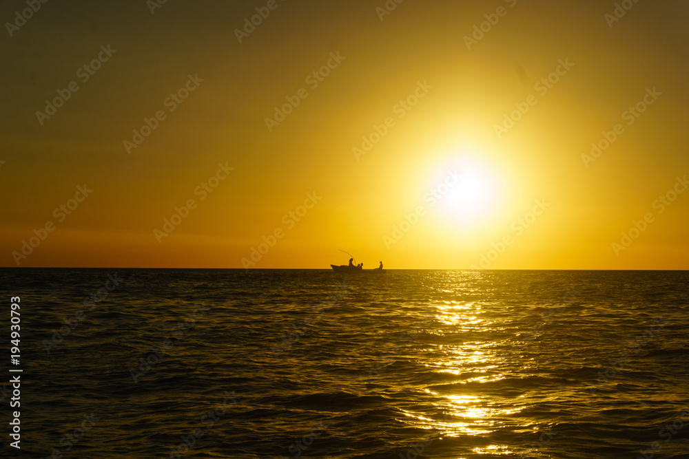Fototapeta premium Fishermans at sunset