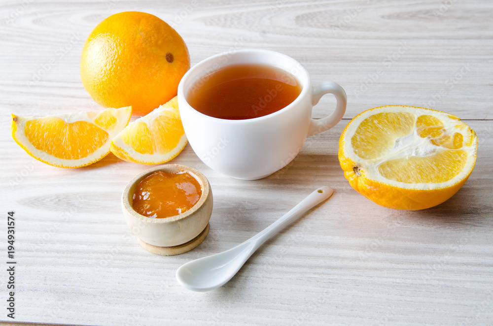 Cup of tea served with orange jam Cup of tea served with orange jam
