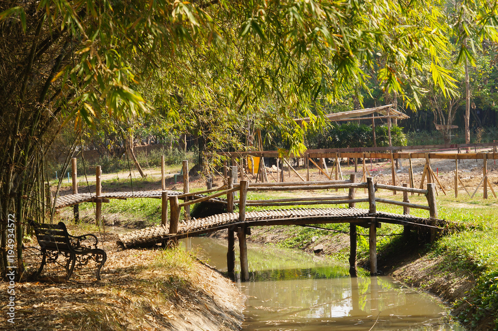 View of canal  with wooden bridge in the morning,Thailand.