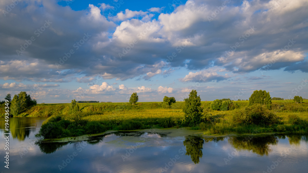 beautiful summer landscape of the river and forest. blue sky with clouds. Western Siberia, Russia
