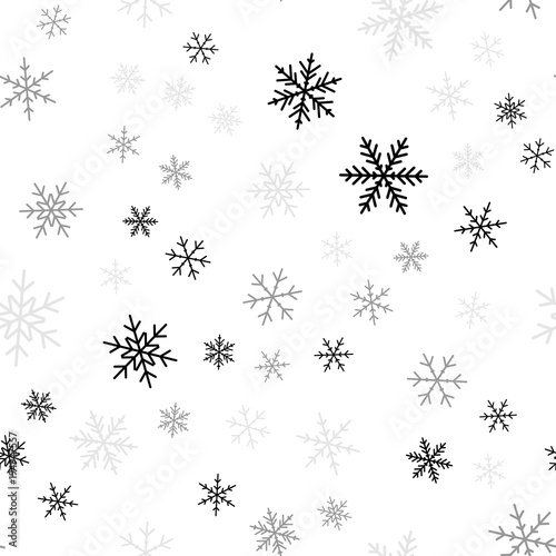 Black snowflakes seamless pattern on white Christmas background. Chaotic scattered black snowflakes. Delightful Christmas creative pattern. Vector illustration.