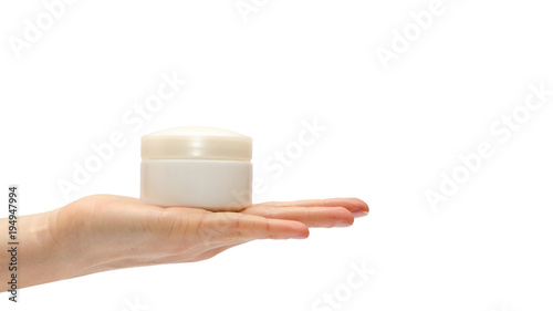 hand of young girl holding cream bottle. Isolated on white background. copy space, template.