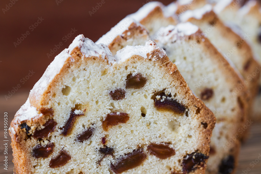Homemade traditional chopped cupcake with raisins on the wooden background. Closeup, selective focus Homemade traditional chopped cupcake with raisins on the wooden background. Closeup, selective focus