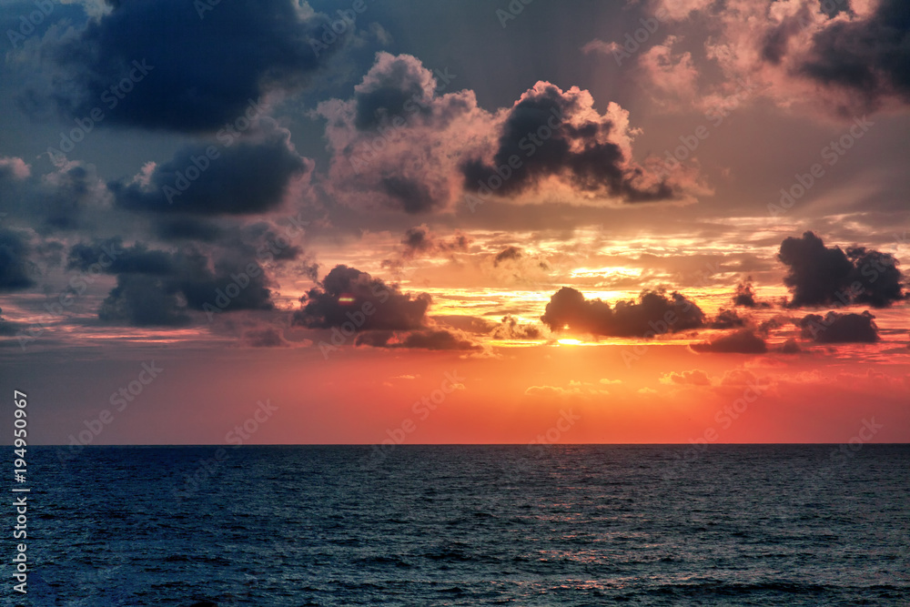 Beautiful stunning sunset at the sea, bright natural colors, background and texture Beautiful stunning sunset at the sea, bright natural colors, background and texture