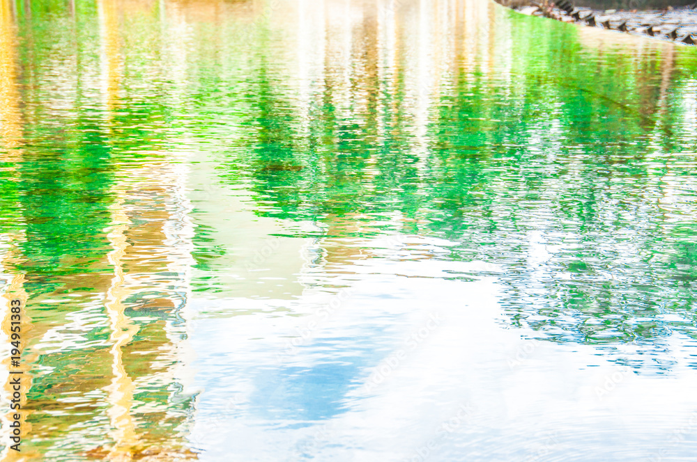 Ripple Water in swimming pool with sun reflection Ripple Water in swimming pool with sun reflection