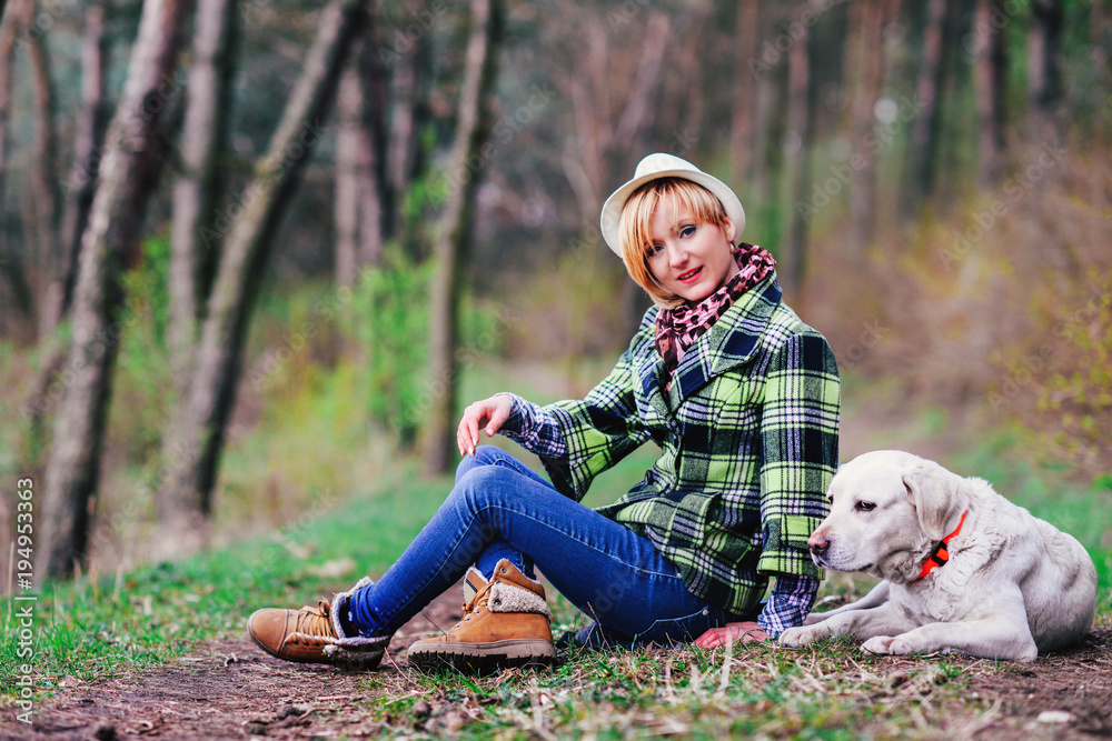 Young girl with a dog in the wood Young girl with a dog in the wood