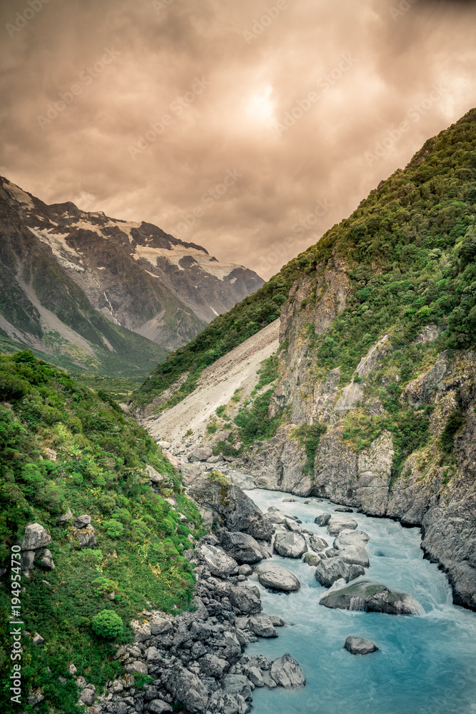 Hooker Valley, Mount Cook, New Zealand - The track leads up the Hooker Valley and along the Hooker River, ending at the glacier lake, where there are amazing views of Aoraki/Mount Cook on a clear day. Hooker Valley, Mount Cook, New Zealand - The track leads up the Hooker Valley and along the Hooker River, ending at the glacier lake, where there are amazing views of Aoraki/Mount Cook on a clear day.