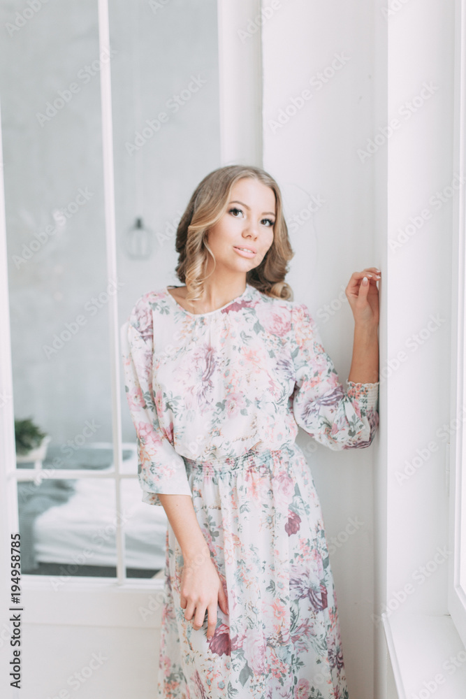 beautiful young blonde woman in nice spring dress, elegant black sunglasses posing in a studio. Fashion spring summer photo beautiful young blonde woman in nice spring dress, elegant black sunglasses posing in a studio. Fashion spring summer photo