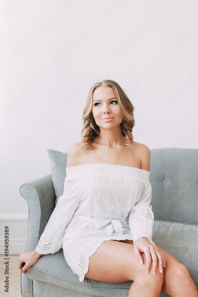 beautiful young blonde woman in nice spring dress, elegant black sunglasses posing in a studio. Fashion spring summer photo beautiful young blonde woman in nice spring dress, elegant black sunglasses posing in a studio. Fashion spring summer photo