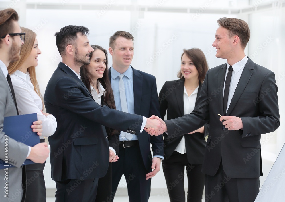 business team looks at the handshake business partners business team looks at the handshake business partners