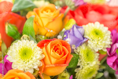 beautiful festive flowers bouquet with orange rose, close up