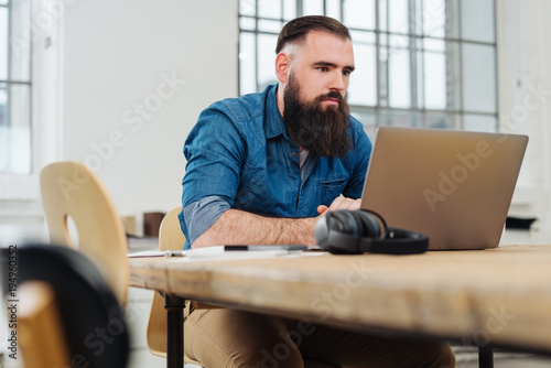 Serious businessman concentrating on his work