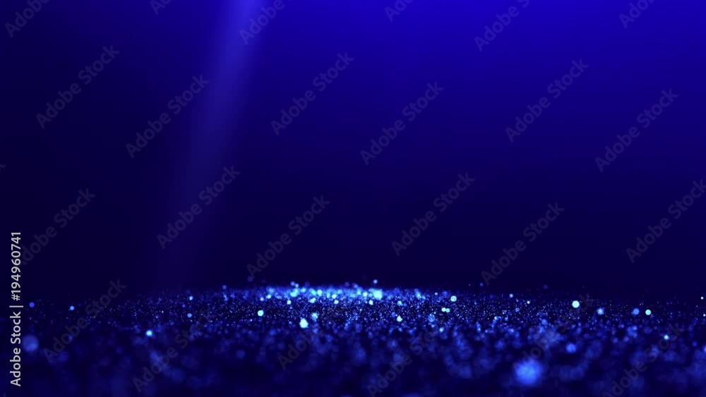 Blue glittering particles with spotlights and blurred background. UHD 4K seamless loop video.
