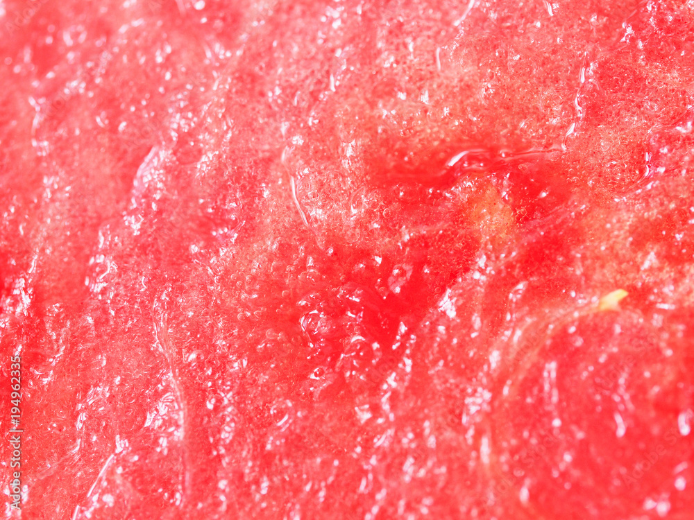 Ripe, juicy, pink, sweet, flesh of watermelon close-up. Seedless watermelon background. Macro. Big red berry, pulp texture. Citrullus lanatus, Cucurbitaceae. Kind of berry with a hard rind, pepo