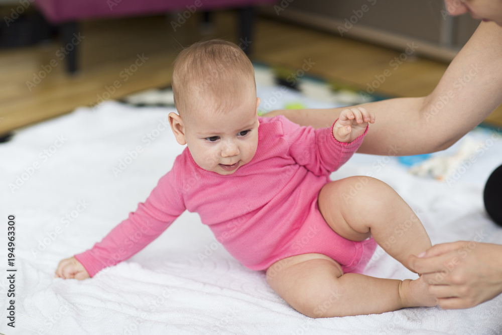 baby sitting up exercise. selective focus baby sitting up exercise. selective focus
